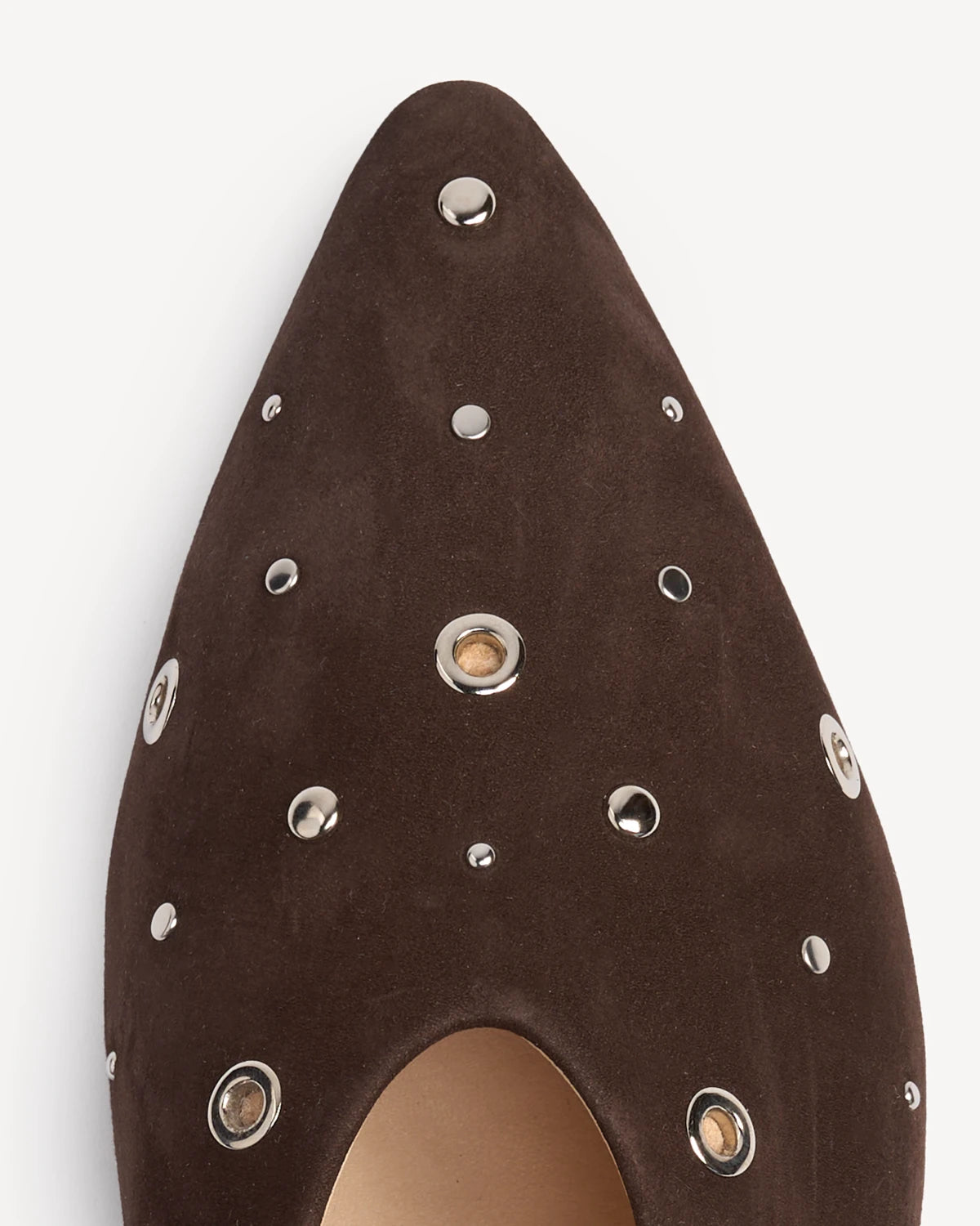 Close-up of the pointed toe with silver studs. The Atelier Flat Cocoa Plum Studded. Sizes 5–12, wide available.