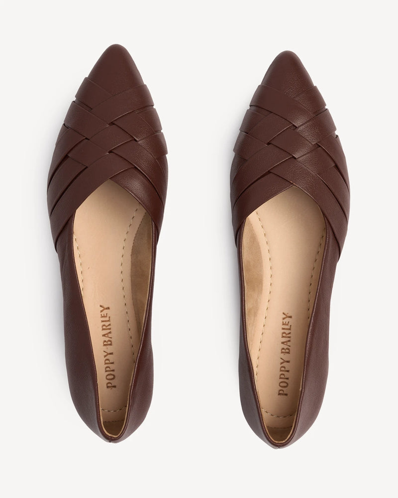 Overhead view of woven leather flats showing basketweave detail. The Athena Flat French Press. Sizes 5–12, wide available.
