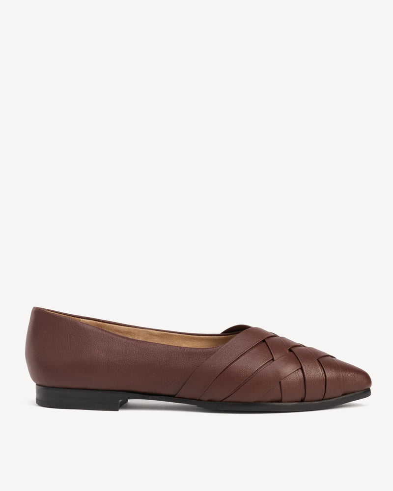 Side view of a woven leather flat with a pointed toe and low sole. The Athena Flat French Press. Sizes 5–12, wide available.