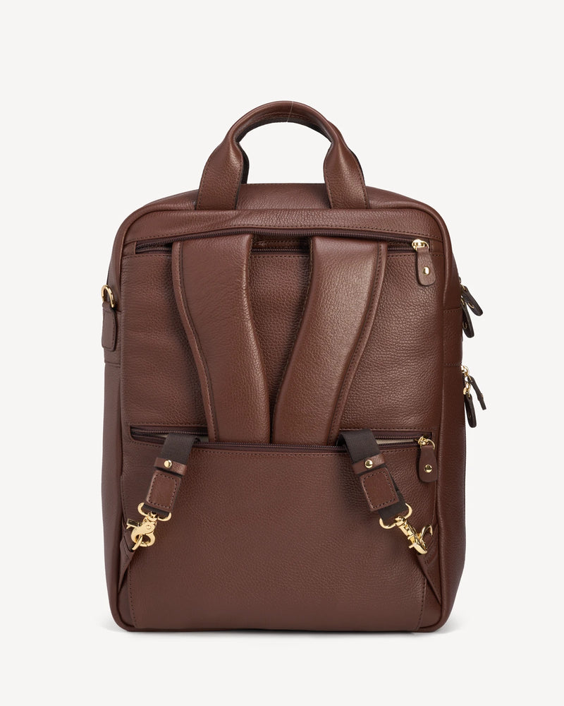 Back view of the pebbled-leather backpack showing straps and zip pocket. The Backpack French Press.