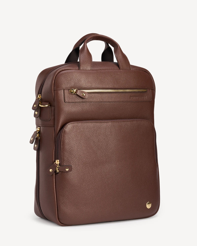 Side view of the pebbled-leather backpack showing front zip pocket. The Backpack French Press.