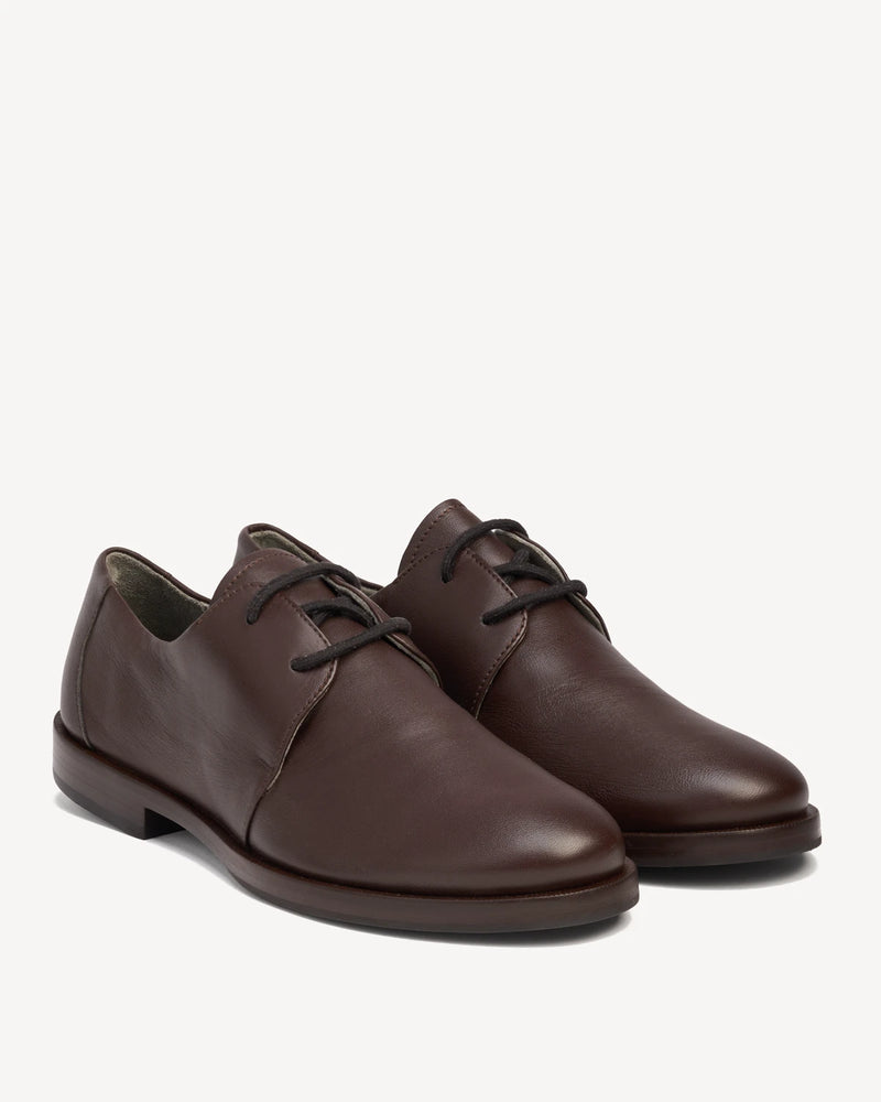 Pair of leather lace-up oxfords at a front angle. The Capsule Oxford Cocoa Plum. Sizes 5–12, wide available.