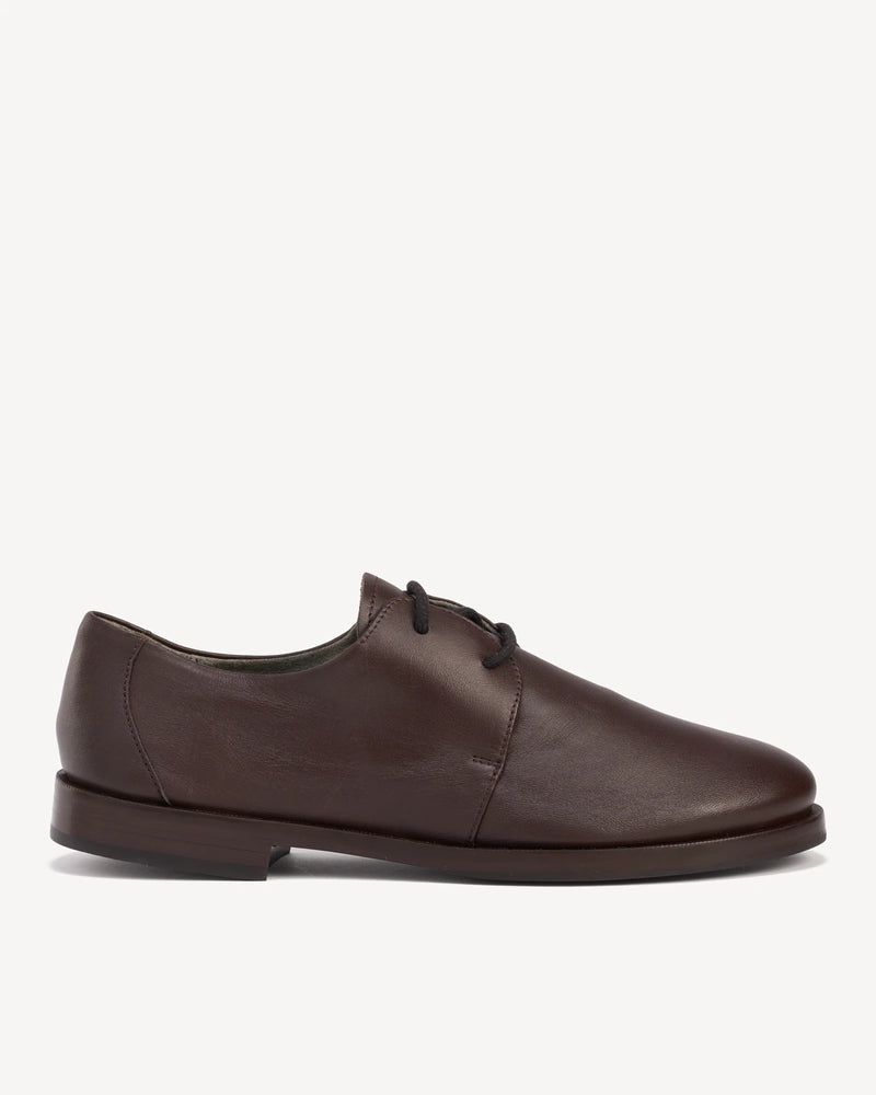 Side view of a leather lace-up oxford with a round toe. The Capsule Oxford Cocoa Plum. Sizes 5–12, wide available.