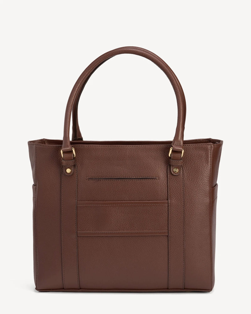 Front view of the structured leather tote showing pocket detailing. The Colleague Tote French Press.