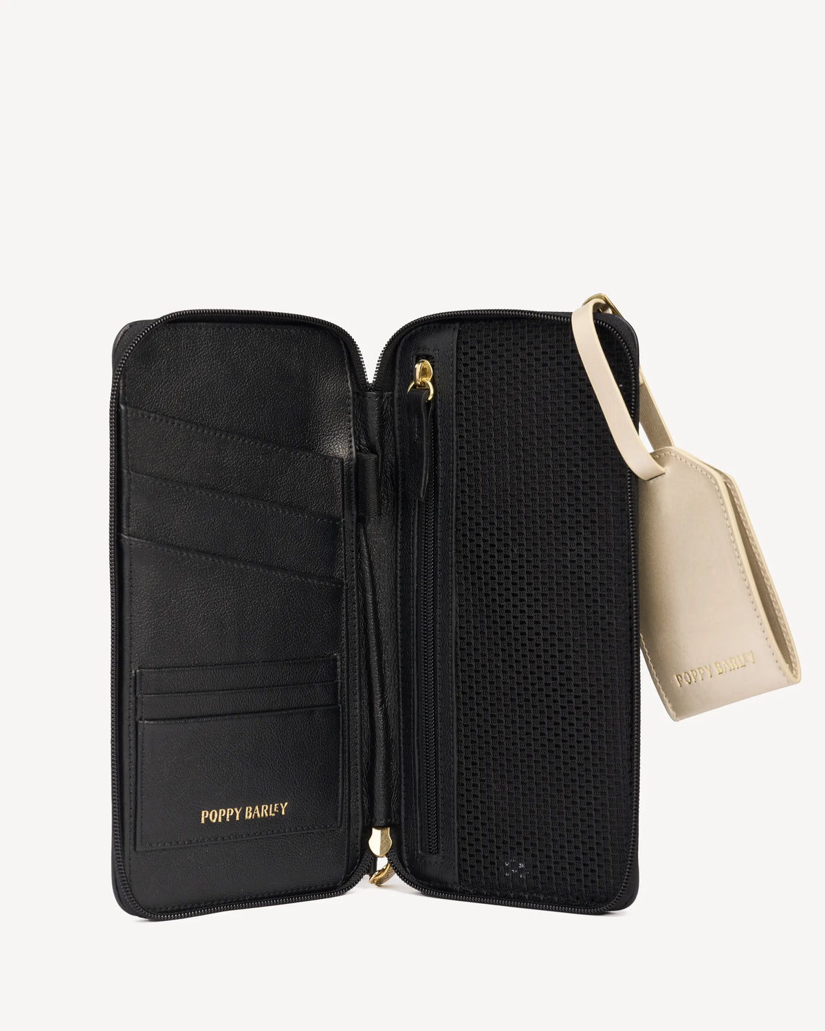 Open passport wallet with card slots beside its luggage tag. The Flying Solo Passport Holder & Slim Luggage Tag Set Black.