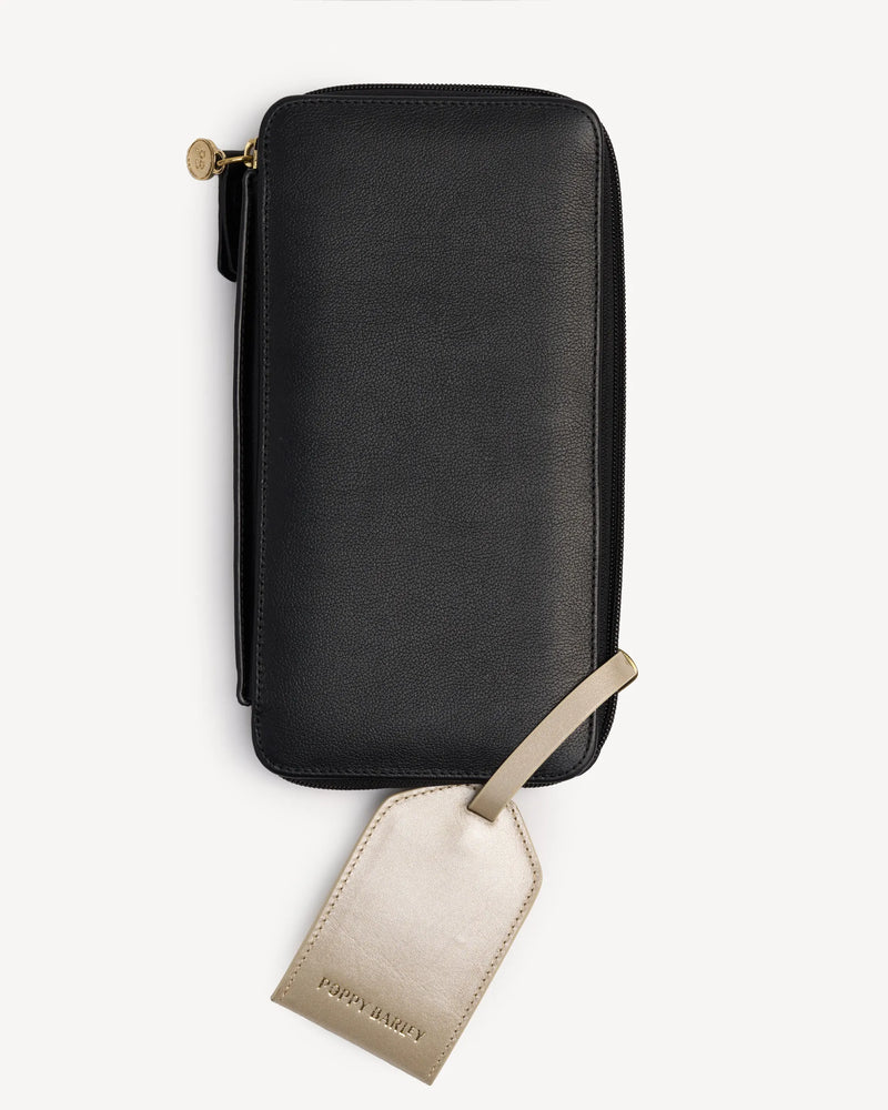 Zip-around passport wallet shown with its attached luggage tag. The Flying Solo Passport Holder & Slim Luggage Tag Set Black.