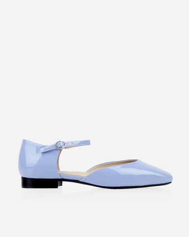 Side profile in glossy patent leather with d'orsay cut, square toe. The Gallery Mary Jane Cornflower Patent. Sizes 5–12.