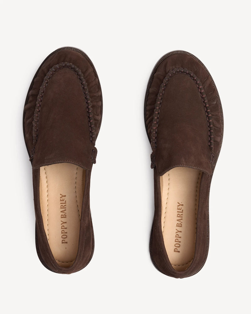 Overhead view of suede loafers showing ruched, braided trim. The Laid Back Loafer Cocoa Plum. Sizes 5–12, wide available.