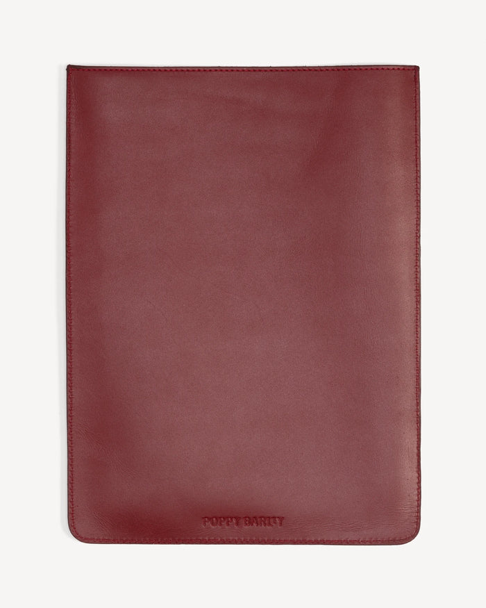 Back view of a flat rectangular leather laptop sleeve. The Laptop Sleeve Resort Red.
