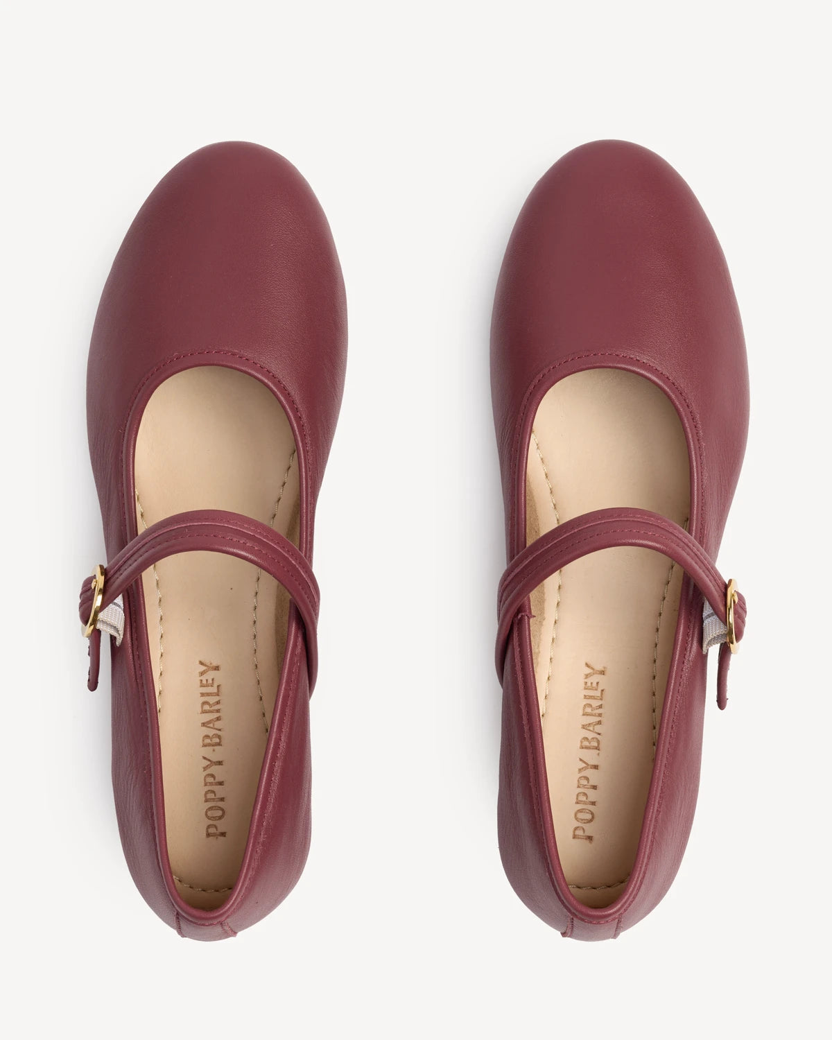 Overhead view of round-toe mary janes showing buckle straps. The Modern-Day Mary Jane Compote. Sizes 5–12, wide available.