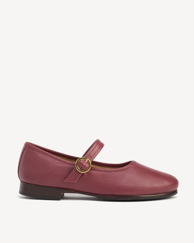Side view of a round-toe mary jane with buckle strap. The Modern-Day Mary Jane Compote. Sizes 5–12, wide available.