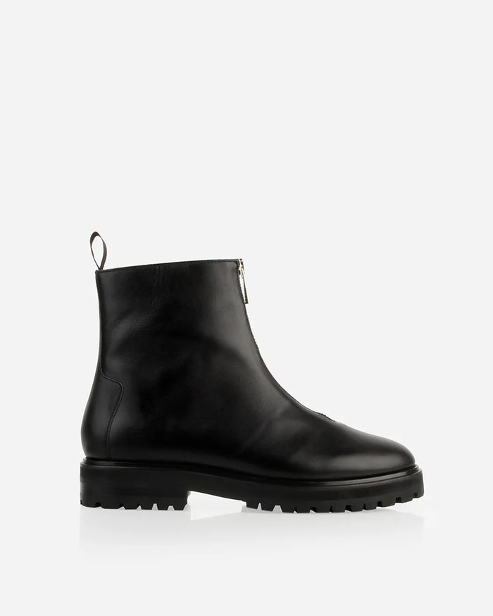 Side view of a leather boot with front zip and chunky lug sole. The Montreal Zip Boot Black WR. Sizes 5–12.