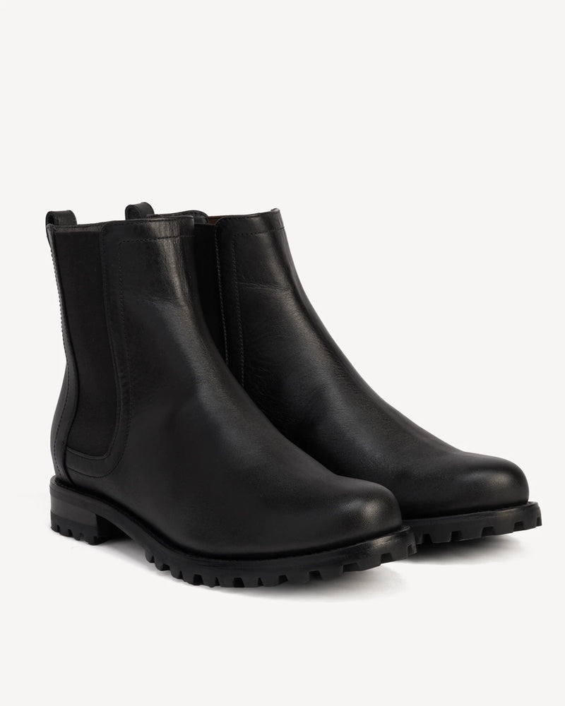 Pair of Chelsea boots at a front angle. The On Tread Chelsea Boot Black Water Resistant. Sizes 5–12, wide available.