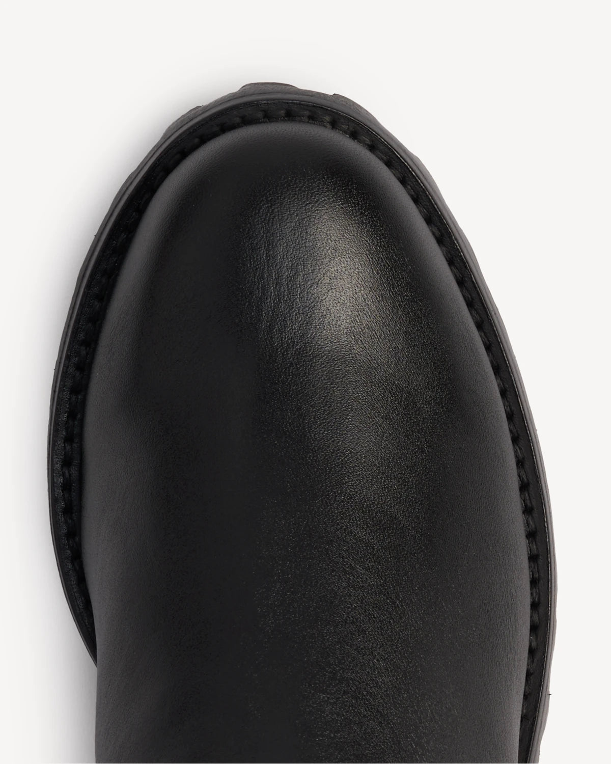 Close-up of the leather toe and lug sole. The On Tread Chelsea Boot Black Water Resistant. Sizes 5–12, wide available.