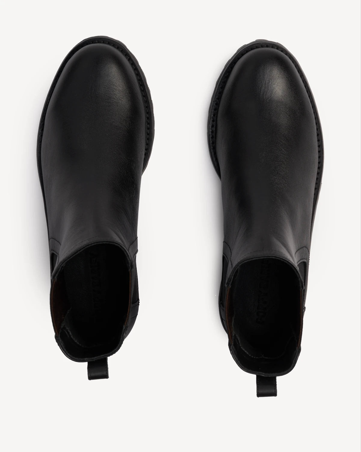 Overhead view of a pair of Chelsea boots. The On Tread Chelsea Boot Black Water Resistant. Sizes 5–12, wide available.