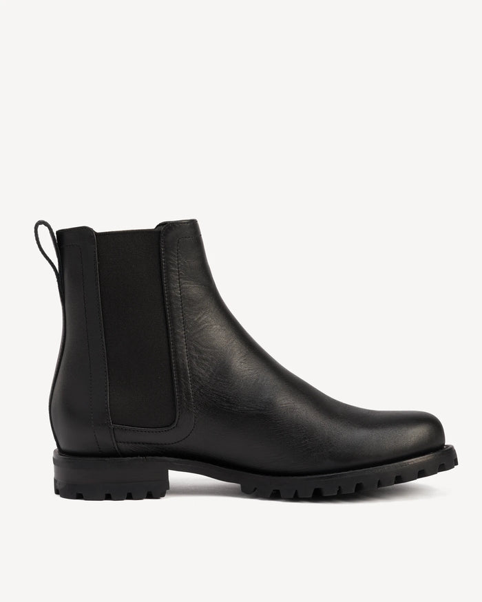 Side view of a leather Chelsea boot. The On Tread Chelsea Boot Black Water Resistant. Sizes 5–12, wide available.