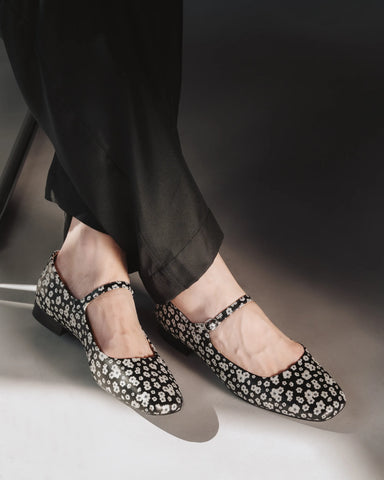 Side profile with an adjustable ankle strap and square toe. The Studio Mary Jane Moonflower. Sizes 5–12.