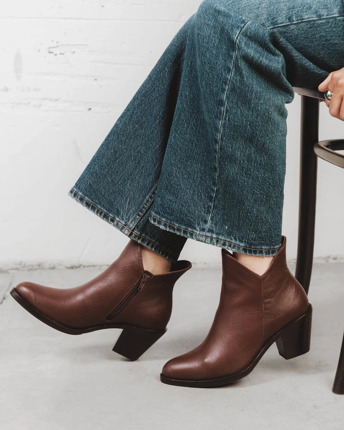 Side view of a pull-on ankle boot with block heel. The Two Point Five Ankle Boot French Press. Sizes 5–12, wide available.