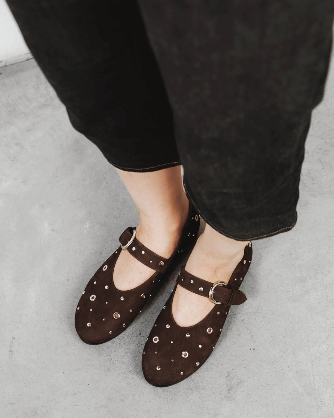 Close-up of studded suede mary janes. The BLVD Mary Jane Cocoa Plum Studded. Sizes 5–12, wide available.