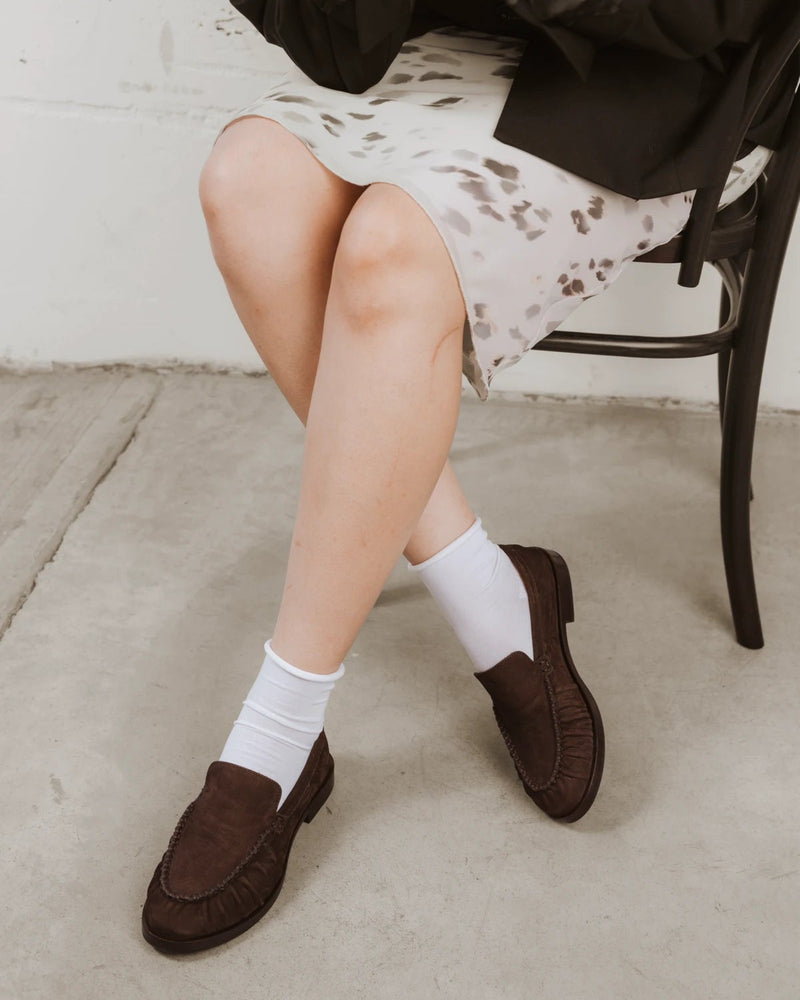 Styled on-foot with brown suede loafers beneath a patterned skirt. The Daily Mid Crew Sock White 3-Pack.