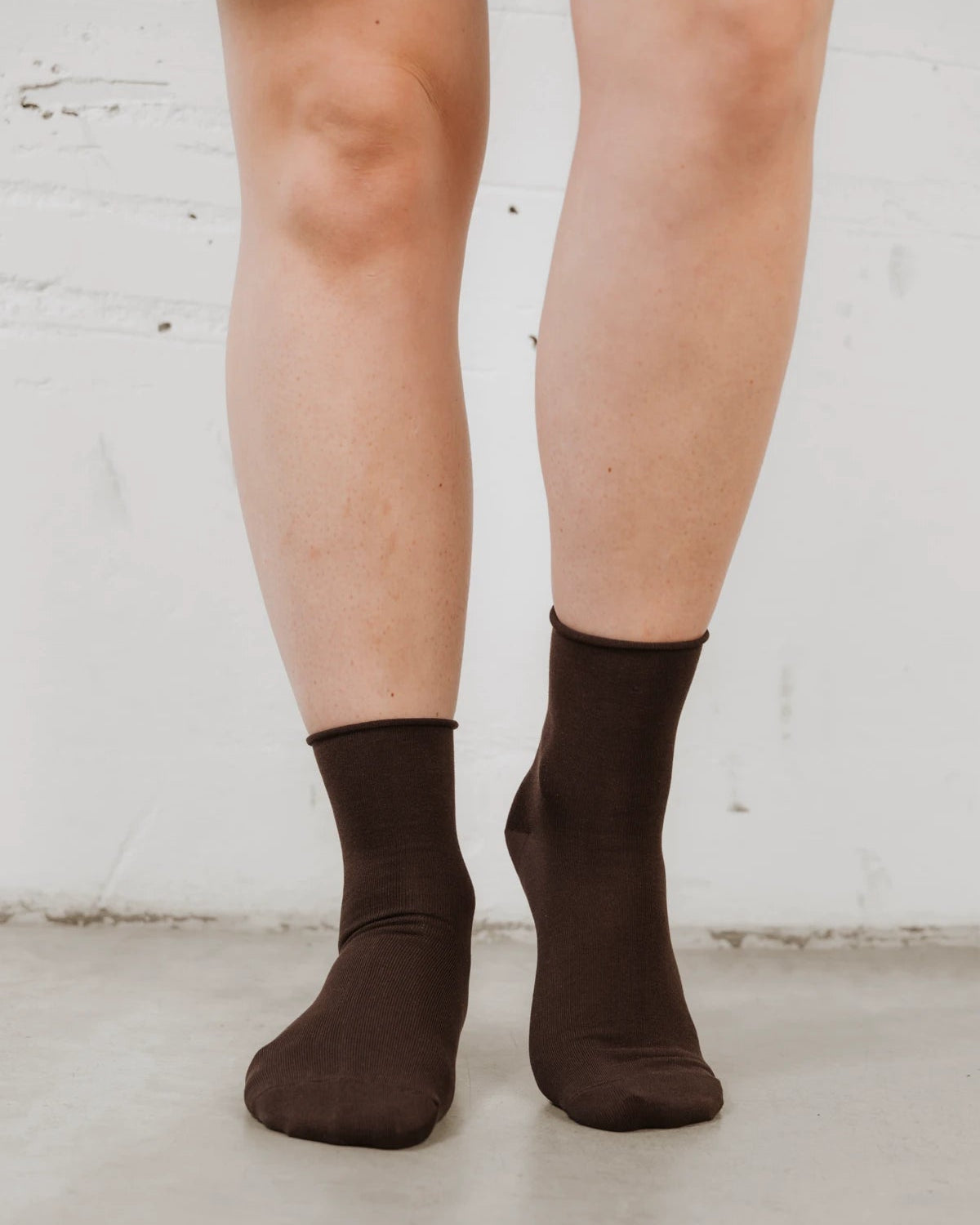 Back view showing rolled cuff and smooth knit texture. The Daily Mid Crew Sock Ganache.