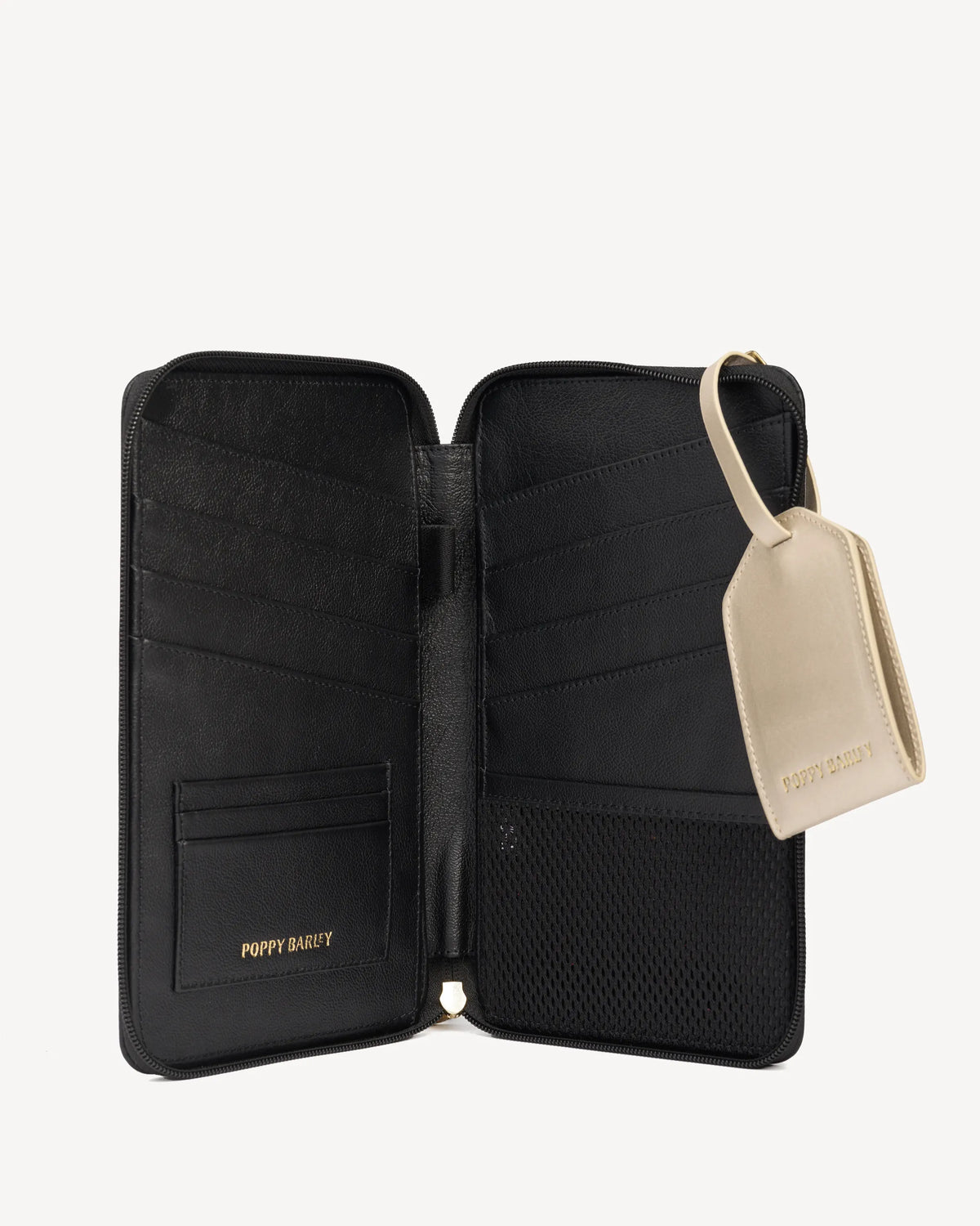 Open passport wallet with card slots beside its luggage tag. The Six Person Passport holder & Slim Luggage Tag Set Black.