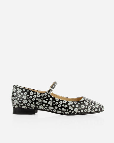Side profile with an adjustable ankle strap and square toe. The Studio Mary Jane Moonflower. Sizes 5–12.