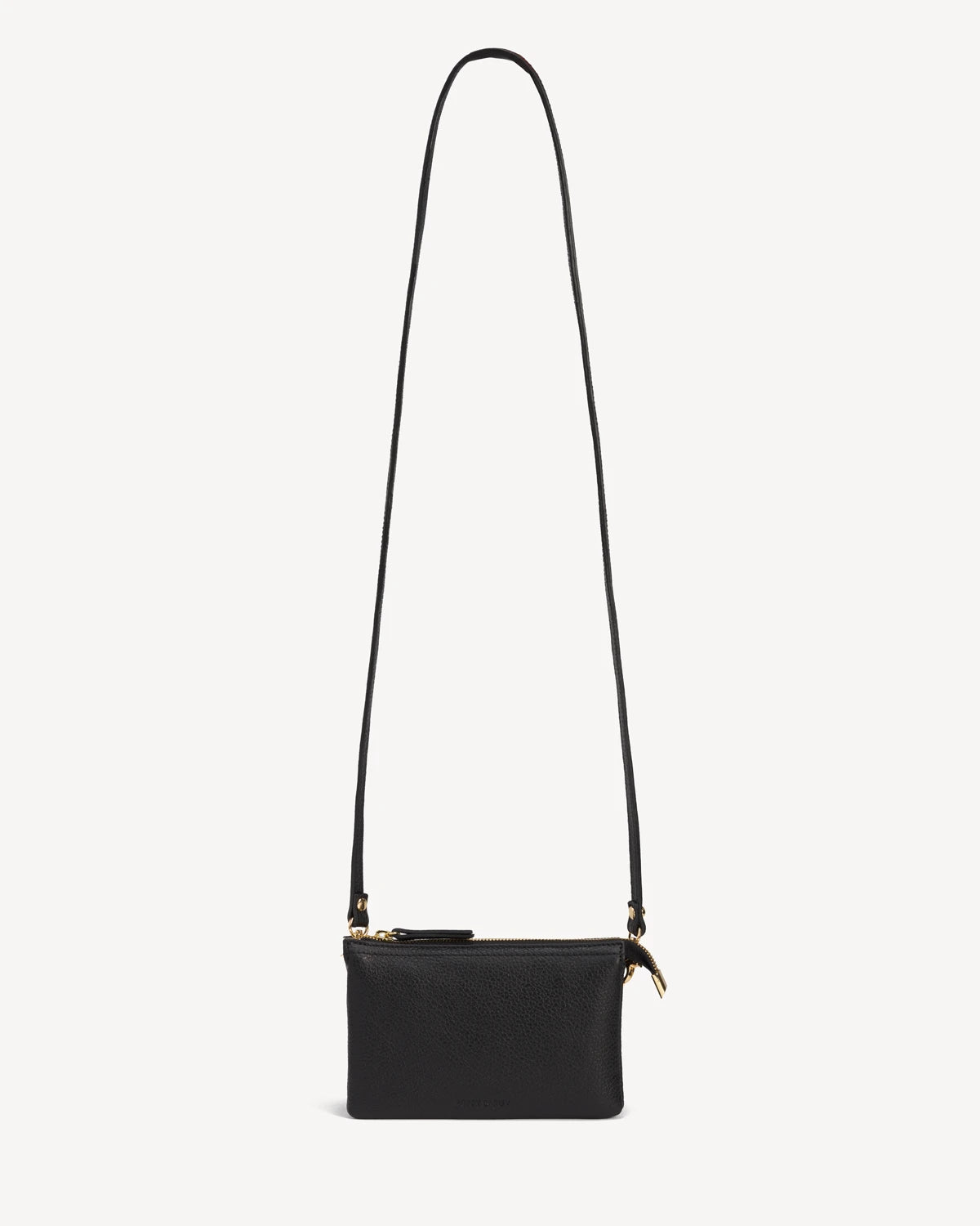 Front view of the pebbled-leather wristlet with a long crossbody strap laid flat. The 3-in-1 Wristlet Black.