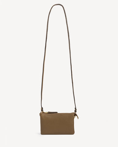 Front view of the pebbled-leather wristlet with a long crossbody strap laid flat. The 3-in-1 Wristlet Tapenade.