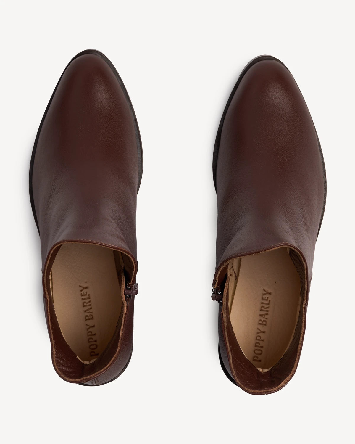 Overhead view of pull-on ankle boots, notched top. The Two Point Five Ankle Boot French Press. Sizes 5–12, wide available.