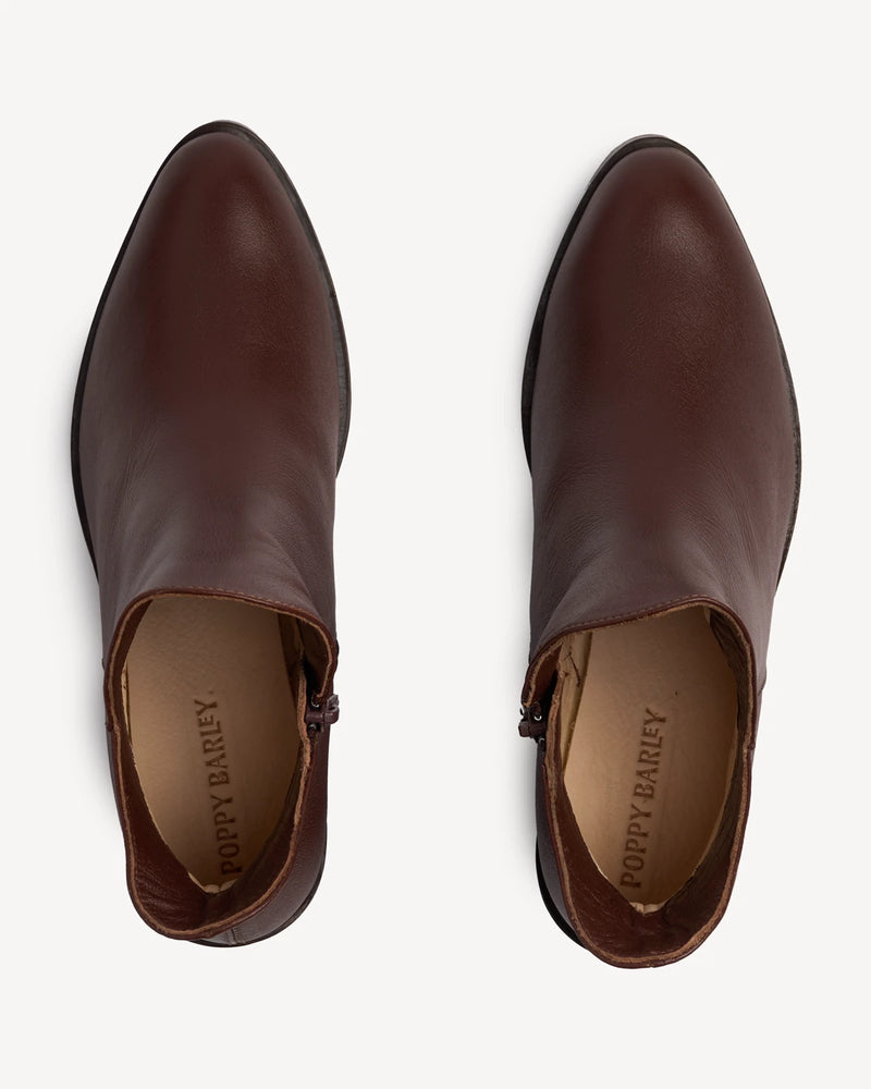 Overhead view of pull-on ankle boots, notched top. The Two Point Five Ankle Boot French Press. Sizes 5–12, wide available.